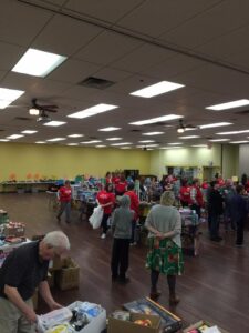 Volunteers bagging up donated toys and items