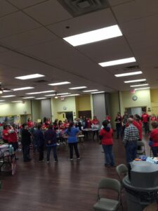 Volunteers in a circle having a meeting