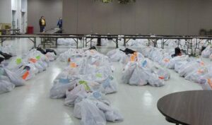 Garbage bags filled with Christmas gifts for families